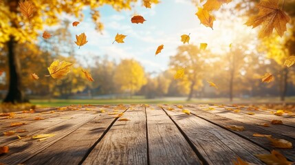 Naklejka na ściany i meble Autumn Background with Falling Yellow Leaves and Wooden Tabletop for Product Display, Featuring a Blurred Natural Scene Perfect for Seasonal Marketing and Copy Space.