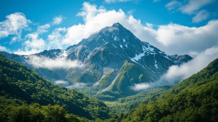 Obraz premium Mountainous Landscape with Lush Greenery and Blue Sky