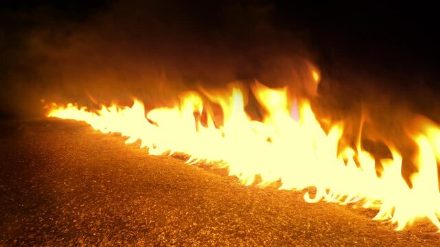 Fire Sweeps Across The Ground In Line
