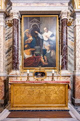 Visitors admire the ornate altar and painting honoring Saint Valentine at Basilica of Santa Maria...