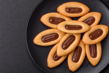 Delicious sweet crispy cookies with chocolate filling in the center