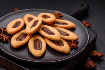 Delicious sweet crispy cookies with chocolate filling in the center