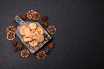 Delicious fresh sweet crispy butter cookies on a dark background