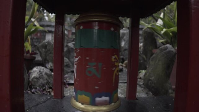 Prayer wheel with the words Om Mani Padme hung, Dharamsala, India.
Buddhism, prayer, spirituality, prayers concept.