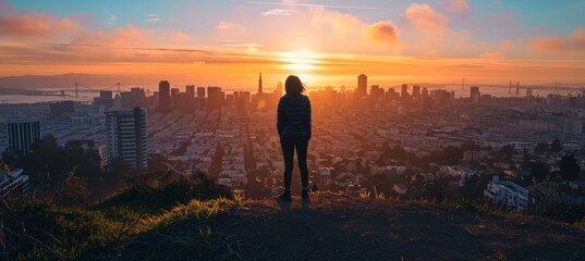 Fototapeta premium Person Standing on Hilltop Overlooking City Skyline at Sunset, Balancing Urban Life and Freedom