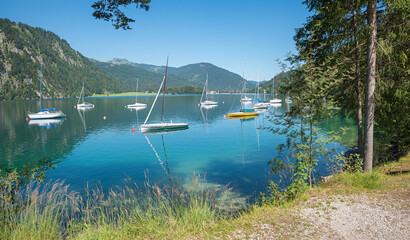 beautiful scenery at lake Achensee with moored sailboats. austrian landscape