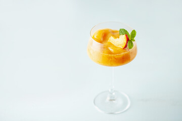Frozen Peach Bellini Cocktail. Summer cold alcoholic drink