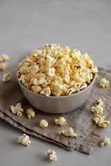 Homemade Salty Popcorn in a Bowl, side view.