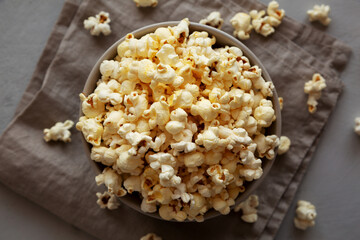 Homemade Salty Popcorn in a Bowl, top view.