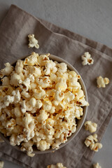 Homemade Salty Popcorn in a Bowl, top view. Flat lay, overhead, from above.