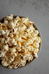 Homemade Salty Popcorn in a Bowl, top view. Flat lay, overhead, from above.