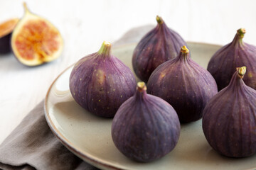 Raw Organic Figs on a Plate, side view.