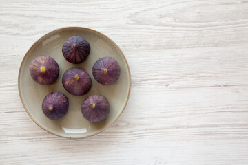 Raw Organic Figs on a Plate, top view. Copy space.