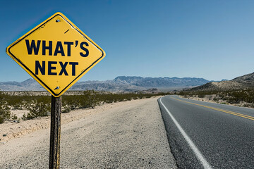Under a clear sky, a yellow road sign asks "WHAT'S NEXT?" as it stands before a winding desert road, symbolizing both uncertainty and future possibilities.