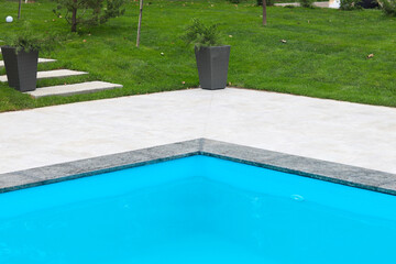 The territory of a country house with a swimming pool. The territory of the recreation complex.