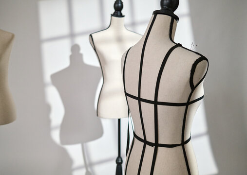 Dress Forms Media Mannequins with seamstress tailor tailoring in warehouse loft Atelier studio with window lighting