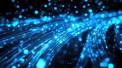 A dynamic abstract representation of glowing blue particles and flowing lines.