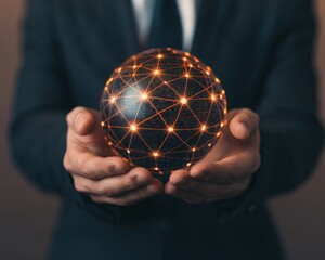 A businessman holds a glowing orb representing global connection and network.
