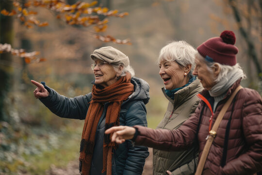 three older women friends  are hiking in the foliage park watching the fall leaves,enjoy their companions