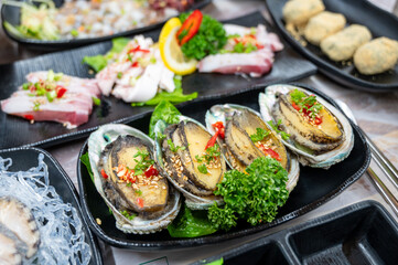 Korean seafood dishes. Grilled abalone shell