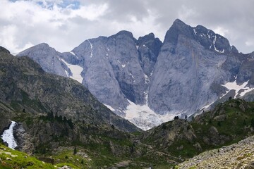 Beautiful scenery of Pyrenees National Park. Tourist trail to Refuge des Oulettes de Gaube around mountain massif with glacier Oulettes and Vignemale - the highest peak of French Pyrenees.