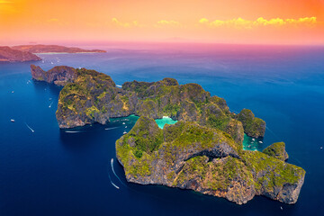 Aerial top view sunset Maya Bay in island Phi Phi Leh, turquoise clear water in Krabi Thailand....