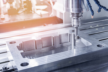 Closeup CNC milling machine during operation with engine turbine housing. Produced cutting metal...