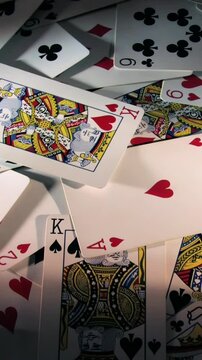 Vertical view of rotating playing cards.  	