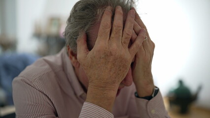 Senior man in despair, displaying a deeply contemplative and concerned expression, indoor setting, capturing emotional depth and personal struggle