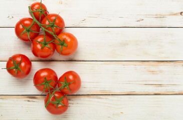 Fresh tomatoes on wooden background, top view