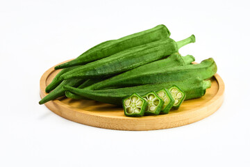 Fresh Okra on Wooden Board