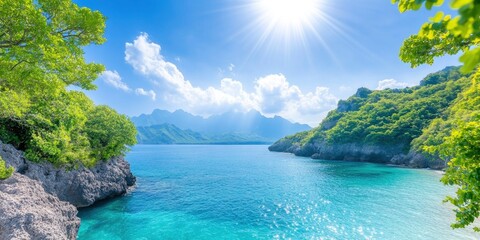 Obraz premium An expansive view of the ocean and a blue sky with sunbeams shining overhead