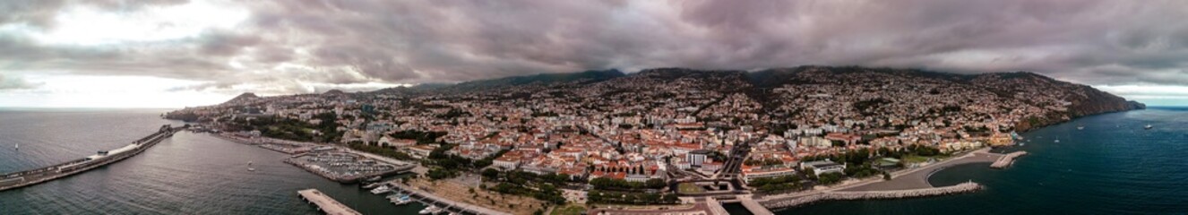 Drone aerial panoramic photography of Funchal City, the capital and largest city on the Madeira Island, Portugal