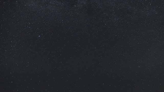 Time-lapse of the Milky Way moving across the night sky. Captures the mesmerizing motion of stars and cosmic detail in a clear, dark sky.