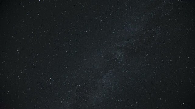 Time-lapse of the Milky Way moving across the night sky. Captures the mesmerizing motion of stars and cosmic detail in a clear, dark sky.