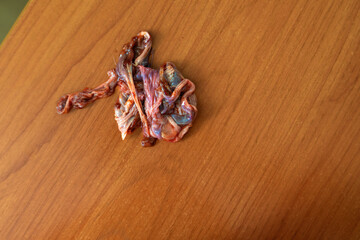 inedible remnants of beef liver rest on a table, symbolizing the thin line between nourishment and waste. A poignant reminder of our relationship with food