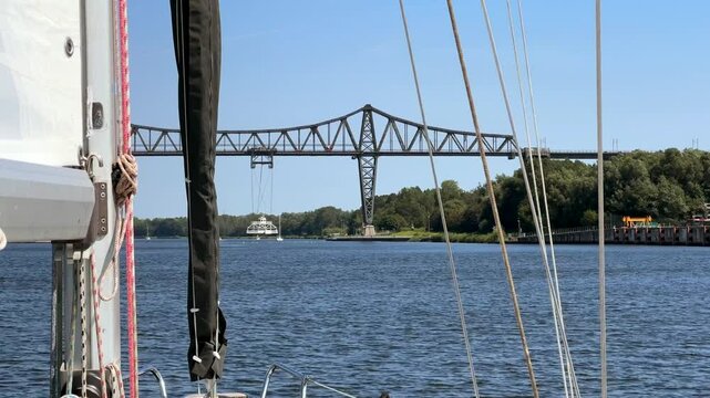 Schwebef&auml;hre Rendsburg suspended ferry crossing from high steel suspension bridge across the kiel canal nord ostsee kanal through germany in summer