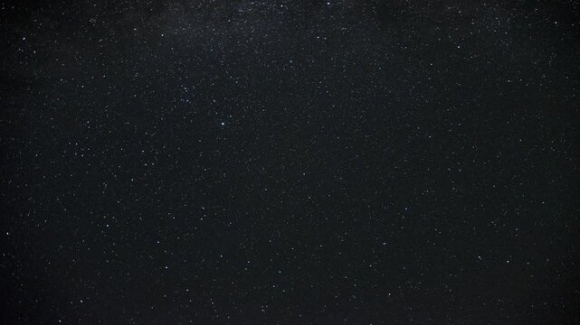 Time-lapse of the Milky Way moving across the night sky. Captures the mesmerizing motion of stars and cosmic detail in a clear, dark sky.