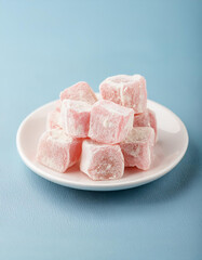 Turkish delight, soft chewy cubes of sugar-dusted confection flavored with rosewater or pistachio