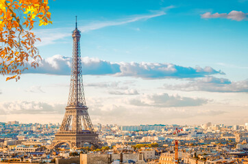 famous Eiffel Tower landmark and Paris old roofs at fall, Paris France, toned