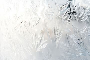 A white surface with a frosted, glass-like texture. The surface appears translucent and smooth with a subtle, icy pattern that catches and diffuses light.