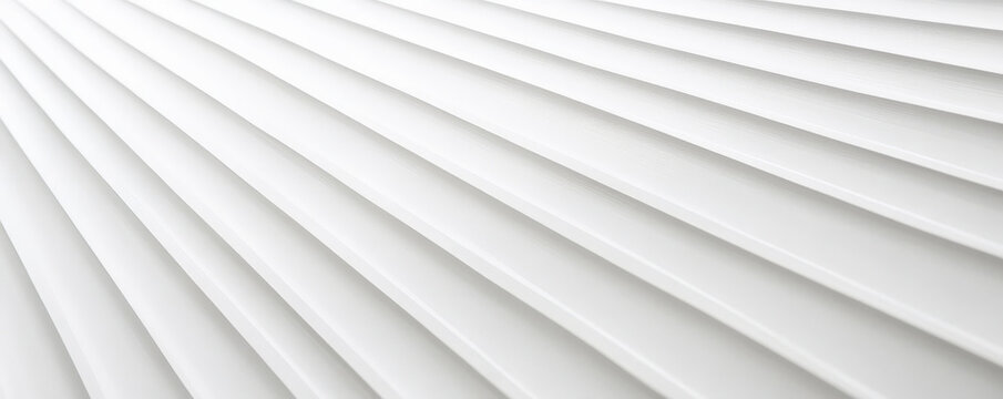 A white surface with a corrugated texture, featuring parallel ridges and grooves. The texture creates a dynamic, industrial feel with strong linear elements.