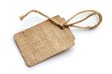 A simple tag tied to a white surface, suitable for various uses such as labels or decorations