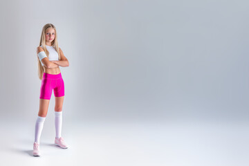 Fototapeta premium sporty young teenage girl in sport suit, leggings, top