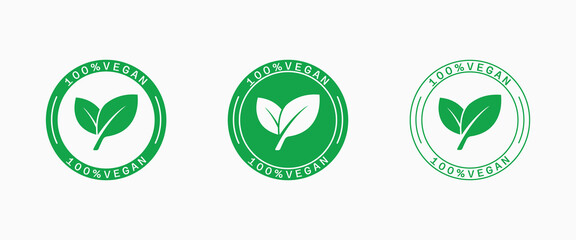 Set of minimalistic 100 % vegan sign with tree leaves. Round vegeterian mark. 