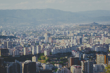 Fototapeta premium Panoramic view of residential areas of Tbilisi from Turtle Lake in summer