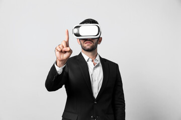 Project manager with virtual reality glasses looking at data analysis while analyzing and pointing data. Skilled business man using VR goggle and digital innovation while enter metaverse. Deviation.