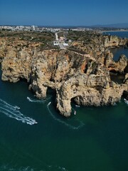 This aerial photo captures the stunning rock formations and turquoise waters at Ponta da Piedade in Lagos, Algarve. 