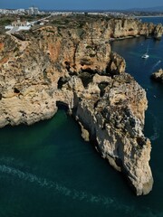 This aerial photo captures the stunning rock formations and turquoise waters at Ponta da Piedade in Lagos, Algarve. 