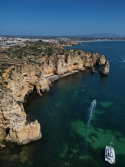 This aerial photo captures the stunning rock formations and turquoise waters at Ponta da Piedade in Lagos, Algarve. 